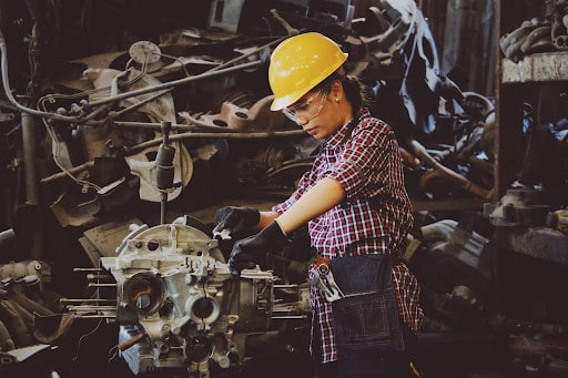 Woman Working on a Machine